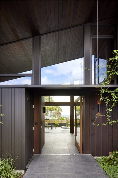 The front entrance is heightened with custom windows to match the ...